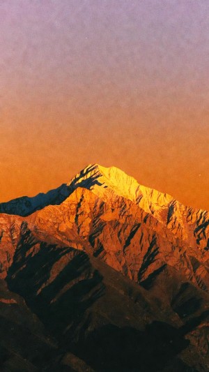 Golden mountain peak at sunset